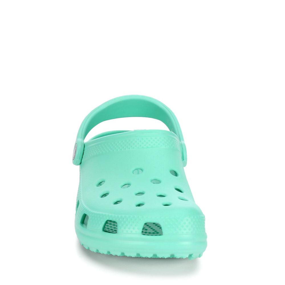 teal green crocs