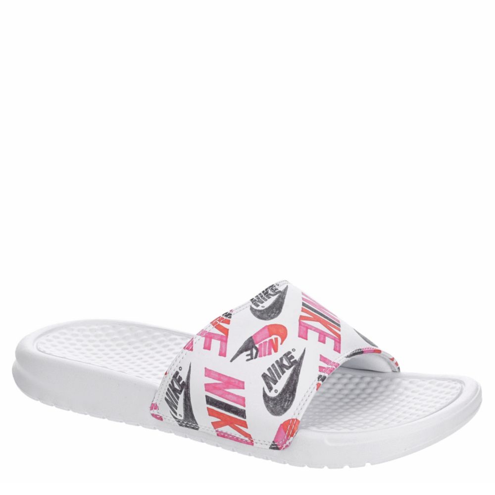 pink and white nike flip flops