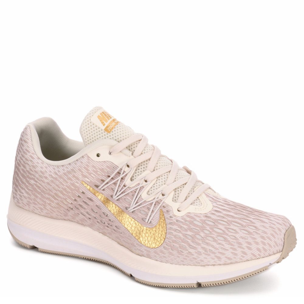 womens white and gold nike trainers