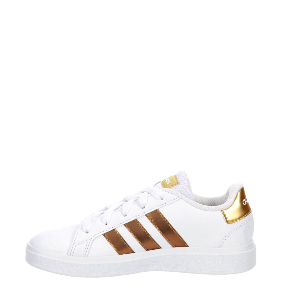 White adidas 2024 with gold stripes